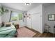 Charming bedroom featuring a cozy twin bed, natural light from the window, and a charming, decorative aesthetic at 3142 Chamblee Gap Rd, Cumming, GA 30040
