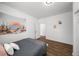 Comfortable bedroom featuring wood floors, bright decor, a modern ceiling fan, and an abundance of natural light at 3142 Chamblee Gap Rd, Cumming, GA 30040