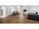 Spacious bedroom featuring an open layout, wood floors, and inviting seating area, perfect for relaxation and comfort at 3142 Chamblee Gap Rd, Cumming, GA 30040