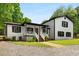 Inviting two-story home with white siding, black trim, and a welcoming front porch at 3142 Chamblee Gap Rd, Cumming, GA 30040