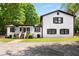 Charming two-story home with white siding, black trim, and inviting front porch at 3142 Chamblee Gap Rd, Cumming, GA 30040