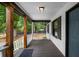 Cozy front porch with wooden posts and railings, offering a warm welcome to the home at 3142 Chamblee Gap Rd, Cumming, GA 30040