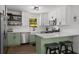 Modern kitchen featuring white cabinets, stainless steel appliances, and a functional island at 3142 Chamblee Gap Rd, Cumming, GA 30040
