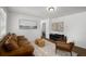 Comfortable living room with modern decor, hardwood floors, and a contemporary entertainment center at 3142 Chamblee Gap Rd, Cumming, GA 30040