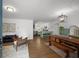 Open-concept living area with hardwood floors, modern furnishings, and stylish decor at 3142 Chamblee Gap Rd, Cumming, GA 30040