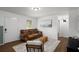 Bright living room with a comfortable leather sofa, stylish decor, and ample natural light at 3142 Chamblee Gap Rd, Cumming, GA 30040
