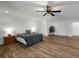 Spacious main bedroom with hardwood floors, a ceiling fan, and natural light at 3142 Chamblee Gap Rd, Cumming, GA 30040