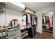 Organized walk-in closet with shelving and hanging racks for ample storage at 3142 Chamblee Gap Rd, Cumming, GA 30040