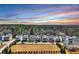 This aerial view displays the neighborhood with a large lawn and beautiful trees at 5293 Hearthstone St, Stone Mountain, GA 30083
