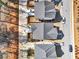 An aerial view shows well-maintained houses, manicured lawns, driveways, and street parking in a well-organized neighborhood at 5293 Hearthstone St, Stone Mountain, GA 30083
