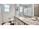 Bathroom featuring a granite countertop, stylish fixtures, and a polka-dot shower curtain at 5293 Hearthstone St, Stone Mountain, GA 30083