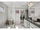 Bathroom featuring a glass-enclosed shower, granite countertops, and a window for natural light at 5293 Hearthstone St, Stone Mountain, GA 30083
