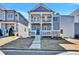 Charming two-story home with a blue front door and double covered balconies at 5293 Hearthstone St, Stone Mountain, GA 30083