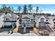 Attractive shot of two-story homes with covered porches, nicely landscaped yards, and neighborhood parking at 5293 Hearthstone St, Stone Mountain, GA 30083