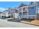 Modern townhomes featuring stylish architecture and well-kept lawns along a quiet street at 5293 Hearthstone St, Stone Mountain, GA 30083