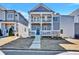 Charming two-story home featuring a welcoming front porch and landscaped yard at 5293 Hearthstone St, Stone Mountain, GA 30083