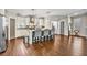 Spacious kitchen features a center island, stainless steel appliances, and hardwood floors at 5293 Hearthstone St, Stone Mountain, GA 30083