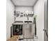 Functional laundry room with modern appliances and ample shelving for storage at 5293 Hearthstone St, Stone Mountain, GA 30083