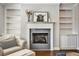 Living room features a fireplace, built-in shelves, and lots of natural light at 5293 Hearthstone St, Stone Mountain, GA 30083