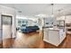 Bright open floor plan with a kitchen, a living room, and hardwood floors at 5293 Hearthstone St, Stone Mountain, GA 30083
