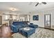 An open-concept living room and kitchen area are connected by gleaming hardwood floors at 5293 Hearthstone St, Stone Mountain, GA 30083