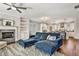 An open-concept living room and kitchen area are connected by gleaming hardwood floors at 5293 Hearthstone St, Stone Mountain, GA 30083