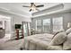 Comfortable main bedroom features a tray ceiling, lots of light and neutral tones at 5293 Hearthstone St, Stone Mountain, GA 30083