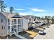 Charming street view of two-story homes with inviting front porches and well-maintained landscaping at 5293 Hearthstone St, Stone Mountain, GA 30083