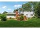 Back of home showcases a deck with stairs leading down to a well-manicured yard at 626 Cheatham Sw Dr, Marietta, GA 30064