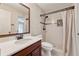 Bathroom featuring a vanity, toilet, and tiled shower at 626 Cheatham Sw Dr, Marietta, GA 30064