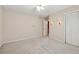 Bedroom with neutral walls features a ceiling fan and a double-door closet at 626 Cheatham Sw Dr, Marietta, GA 30064