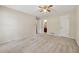 Light-filled bedroom, featuring neutral walls and carpet, with access to a bathroom at 626 Cheatham Sw Dr, Marietta, GA 30064