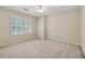 Bedroom features neutral walls, carpet and natural light from the large window at 626 Cheatham Sw Dr, Marietta, GA 30064