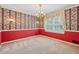 Elegant dining room with chair rail, carpet and a decorative chandelier at 626 Cheatham Sw Dr, Marietta, GA 30064