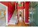 Grand foyer with red accent wall and views of rooms and staircase at 626 Cheatham Sw Dr, Marietta, GA 30064