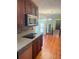 Modern kitchen with stainless steel appliances, granite countertops, and open view to the living room at 626 Cheatham Sw Dr, Marietta, GA 30064