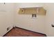 Utility room featuring laminate floor, hookups and a shelf at 626 Cheatham Sw Dr, Marietta, GA 30064