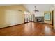 Open concept living room with hardwood floors, stone fireplace, and seamless flow to other rooms at 626 Cheatham Sw Dr, Marietta, GA 30064