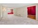 Spacious room featuring neutral carpet, with views into other rooms at 626 Cheatham Sw Dr, Marietta, GA 30064