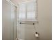 Shower with a built-in window, a shower curtain, a towel rack and a toilet paper holder at 626 Cheatham Sw Dr, Marietta, GA 30064