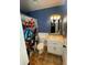 This bathroom includes an Avengers shower curtain, a toilet, a sink and a vanity at 710 Wind Song Trce, Woodstock, GA 30189