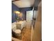 Bathroom has a toilet, sink, vanity, mirror, and Avengers themed shower curtain at 710 Wind Song Trce, Woodstock, GA 30189