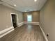 Neutral bedroom featuring modern flooring, neutral color palette and a large window for natural light at 710 Wind Song Trce, Woodstock, GA 30189