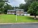 Charming two-story home with a well-manicured lawn and three-car garage at 710 Wind Song Trce, Woodstock, GA 30189