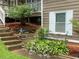 Landscaped garden beds with beautiful plantings that add to the curb appeal of the house at 710 Wind Song Trce, Woodstock, GA 30189