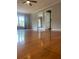 Bright living room featuring hardwood floors, neutral paint, and ample natural light through a large window at 710 Wind Song Trce, Woodstock, GA 30189