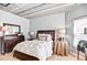 Well-lit bedroom features a large window, decorative table lamps, and stylish furniture at 800 Peachtree Ne St # 1319, Atlanta, GA 30308