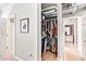 Spacious walk-in closet features ample storage, exposed ceiling pipes, and easy access to the bathroom at 800 Peachtree Ne St # 1319, Atlanta, GA 30308