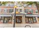 Building entrance featuring street-level retail shops and prominent signage at 800 Peachtree Ne St # 1319, Atlanta, GA 30308