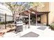 Outdoor grilling area with pergola, gas grills, seating, and privacy fence at 800 Peachtree Ne St # 1319, Atlanta, GA 30308